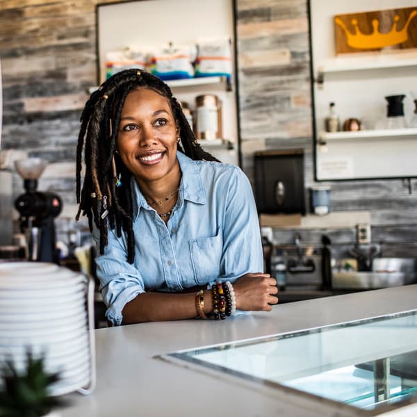 Portrait of female coffeeshop owner in coffeeshop