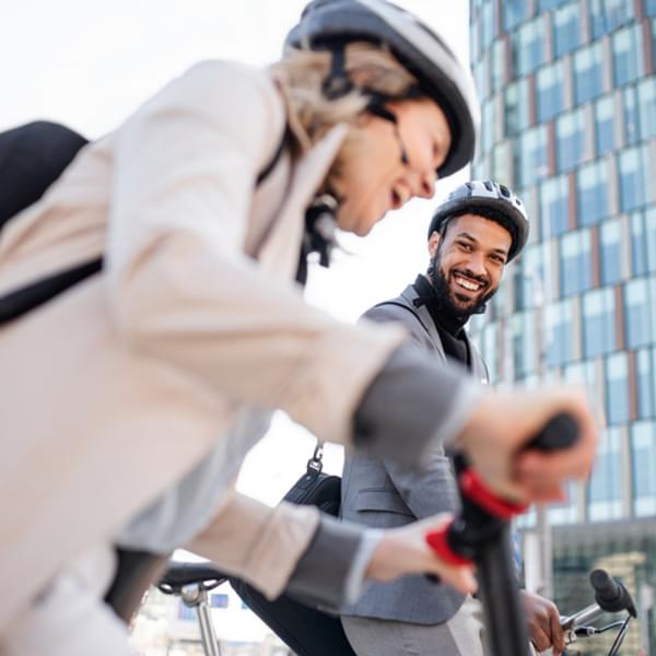 Business people on the way to work, sustainable lifestyle.