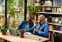 Mature couple buying heat pump water heater online.