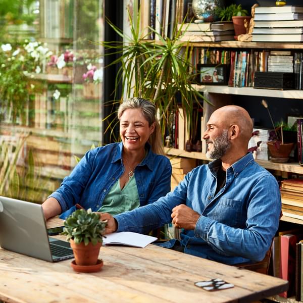 Mature couple buying heat pump water heater online.
