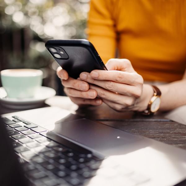 Close up on woman hand using mobile phone