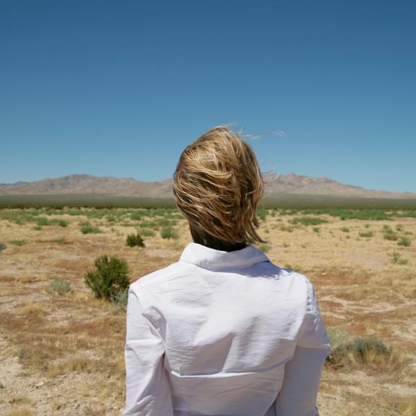 Woman looking at view of desert.