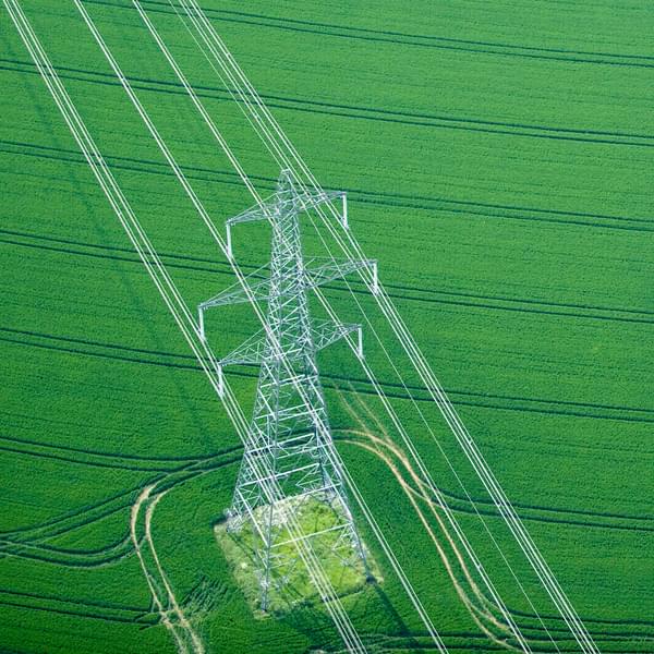 Electricity pylon in wheat field