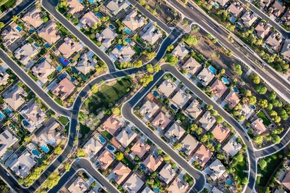 Aerial view looking directly down on homes in a planned exclusive residential community