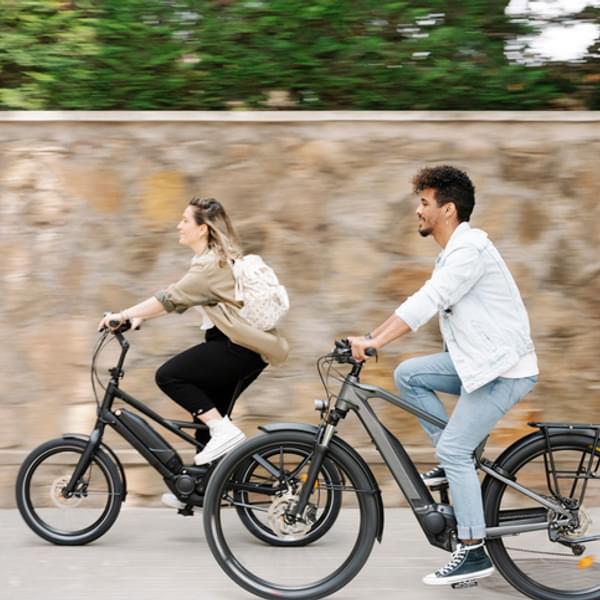 Couple riding electric bicycles