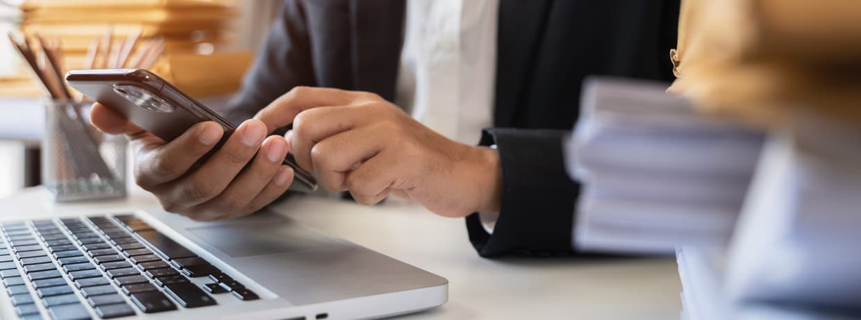 Businessperson typing on keyboard
