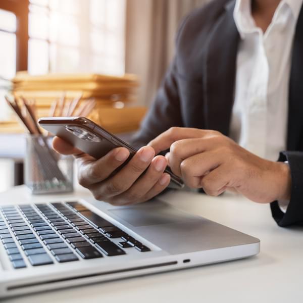 Businessperson typing on keyboard