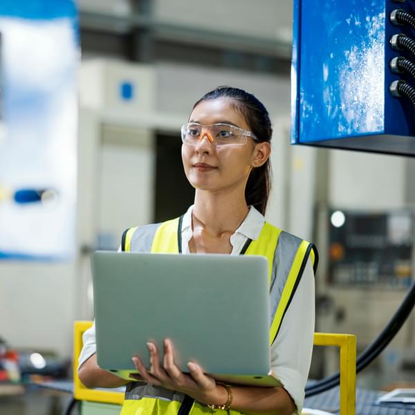 Female energy engineer analyzing data in the field.