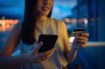 Woman using e-commerce website on her phone to buy products