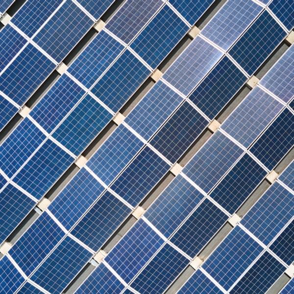 aerial view looking down on a field full of solar panels