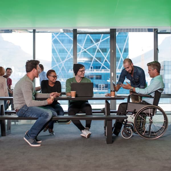 a group of people having a meeting in a modern office