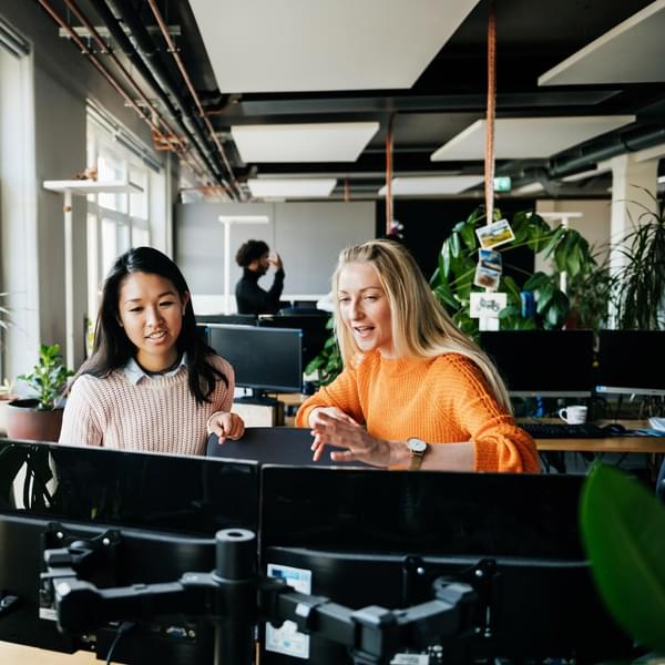 two women working at their desks