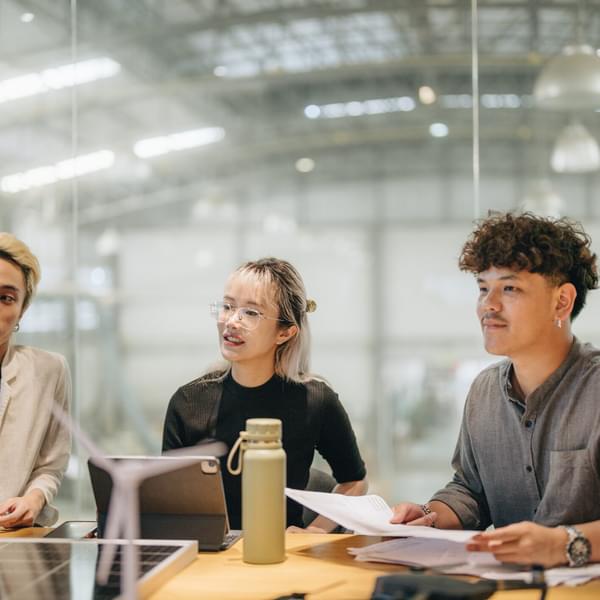 young adults sitting in a meeting