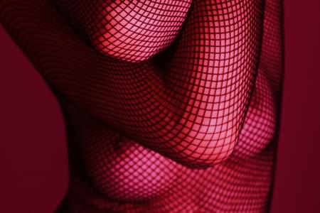 Woman in Fishnet Bodystocking