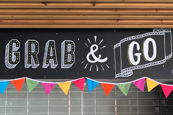 A blackboard with the words 'Grab & Go' on it