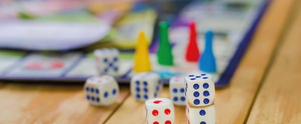 A pile of brightly coloured dice
