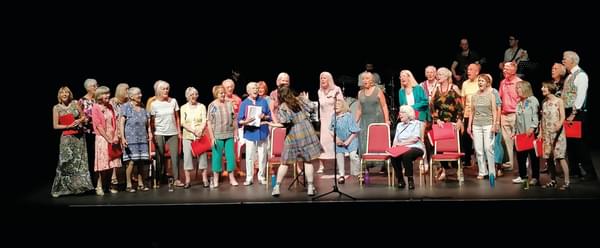 A choir singing on stage