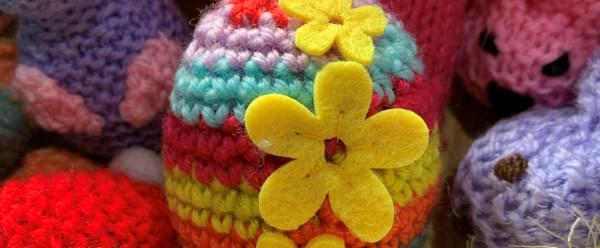 A cluster of brightly coloured crocheted Easter eggs