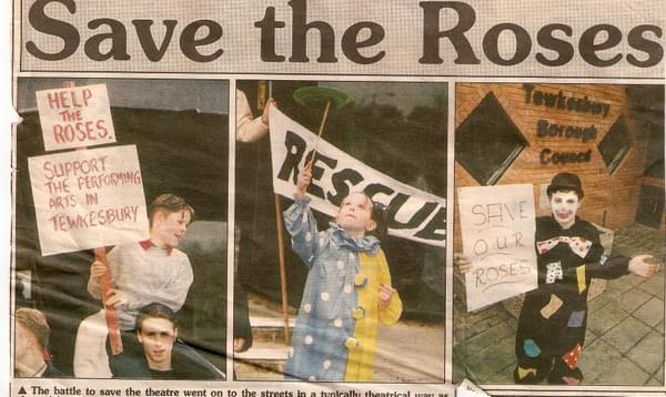 A newspaper clipping of children holding signs. The title of the article says 'Save the Roses'