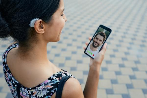 Deaf woman using mobile in Deaf Awareness week