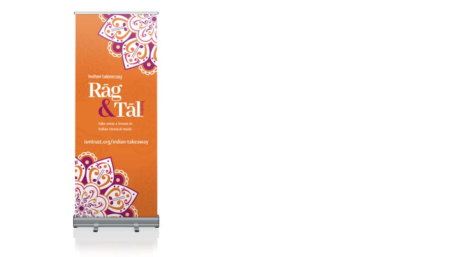 Orange roller banner with a large Rag and Tal logo and mehndi inspired emblem.