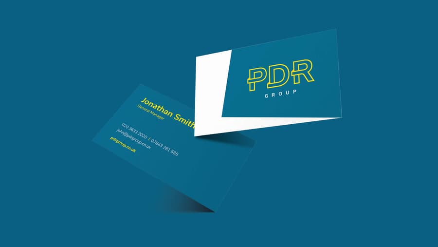 A mockup of the front and back of the PDR Solution business card