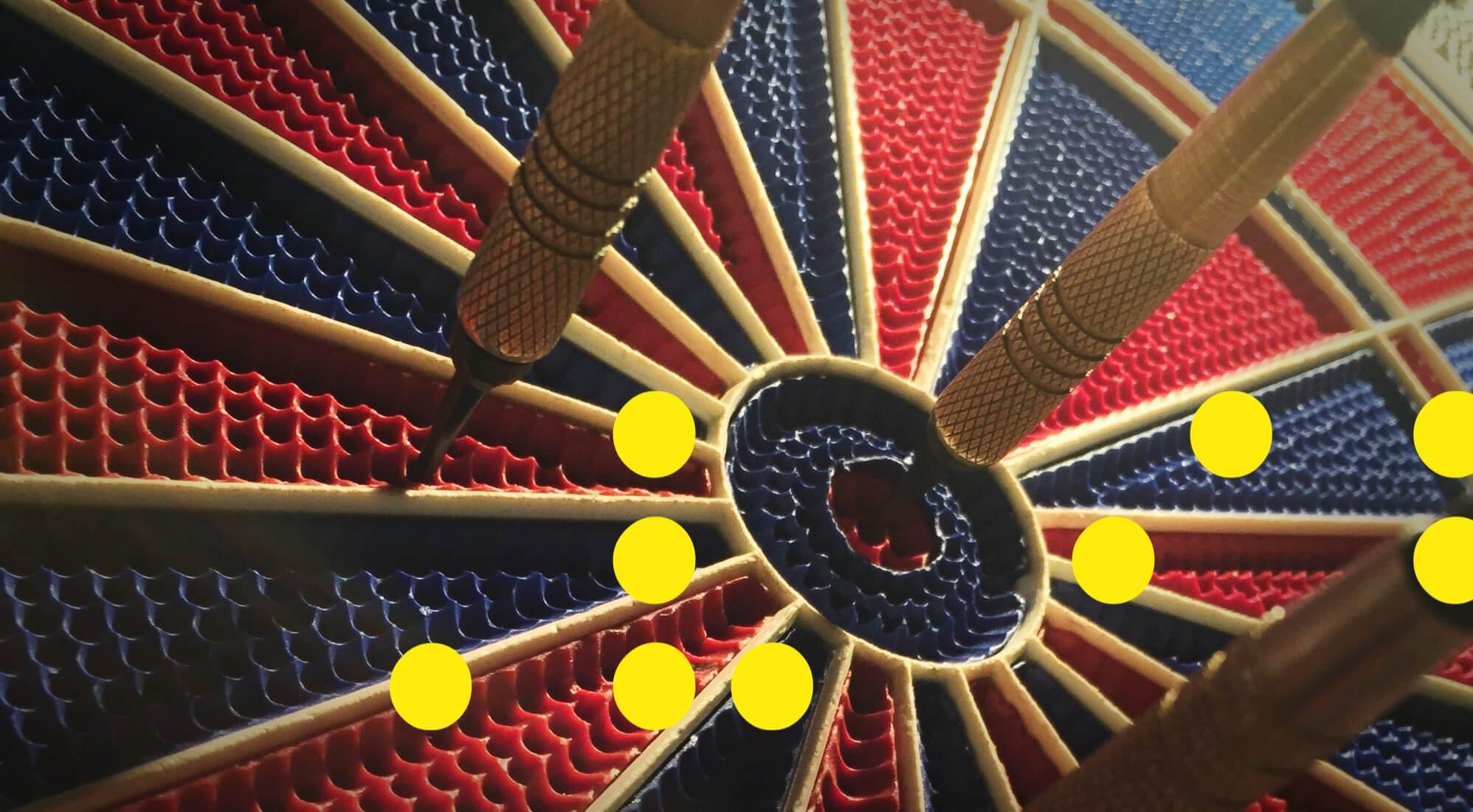 Dart board with a dart in the bullseye