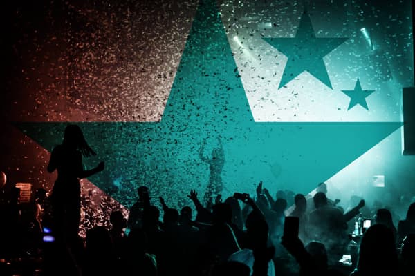 Crowd of people being showered with confetti and the Delegate Wranglers stars blended into the image.