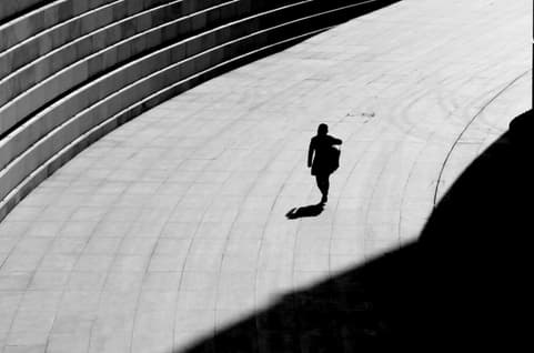 Shadow of a person walking alone