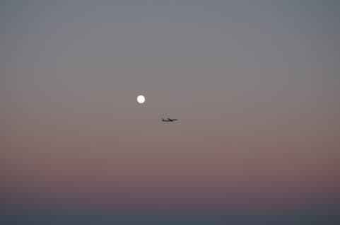 Sky, plane and moon.