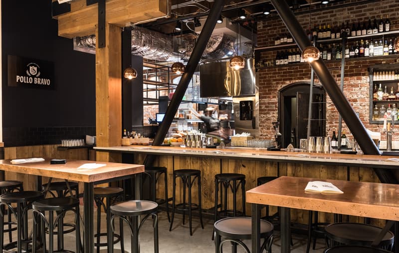 Interior shot of a brick-backed bar and restaurant