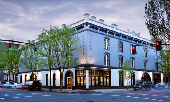 Exterior of a blue and white building at dusk