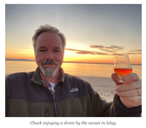 Chuck enjoying a dram by the sunset in Islay.