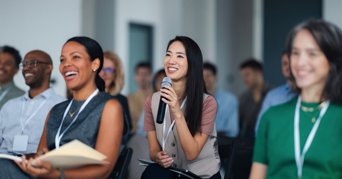 Audience Member Asking a Question at a Healthcare Event
