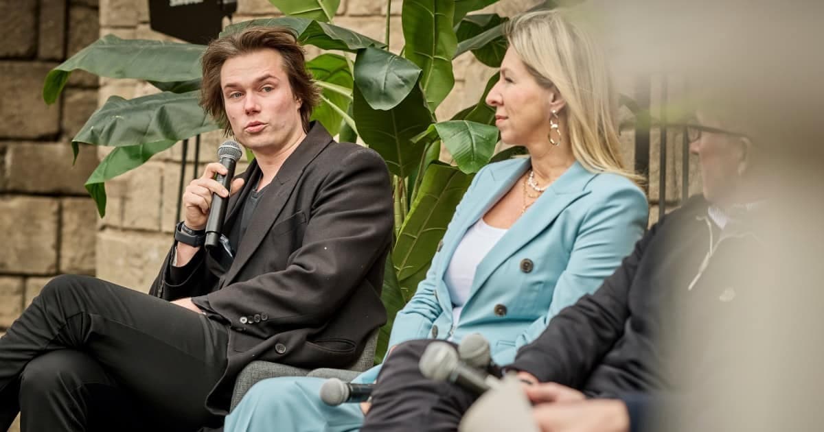 Otto Plesner speaking, Elena Fersman seated beside him on panel