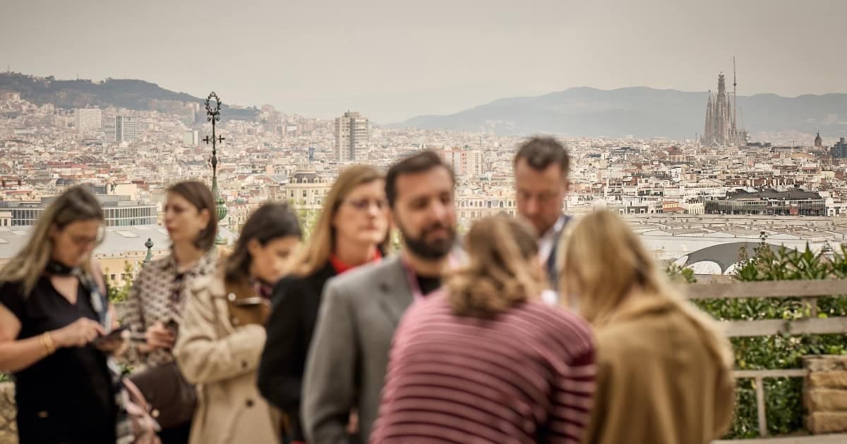 Senior Attendees Networking at Sparks x WIRED Connection Code MWC 2026 with Barcelona Skyline
