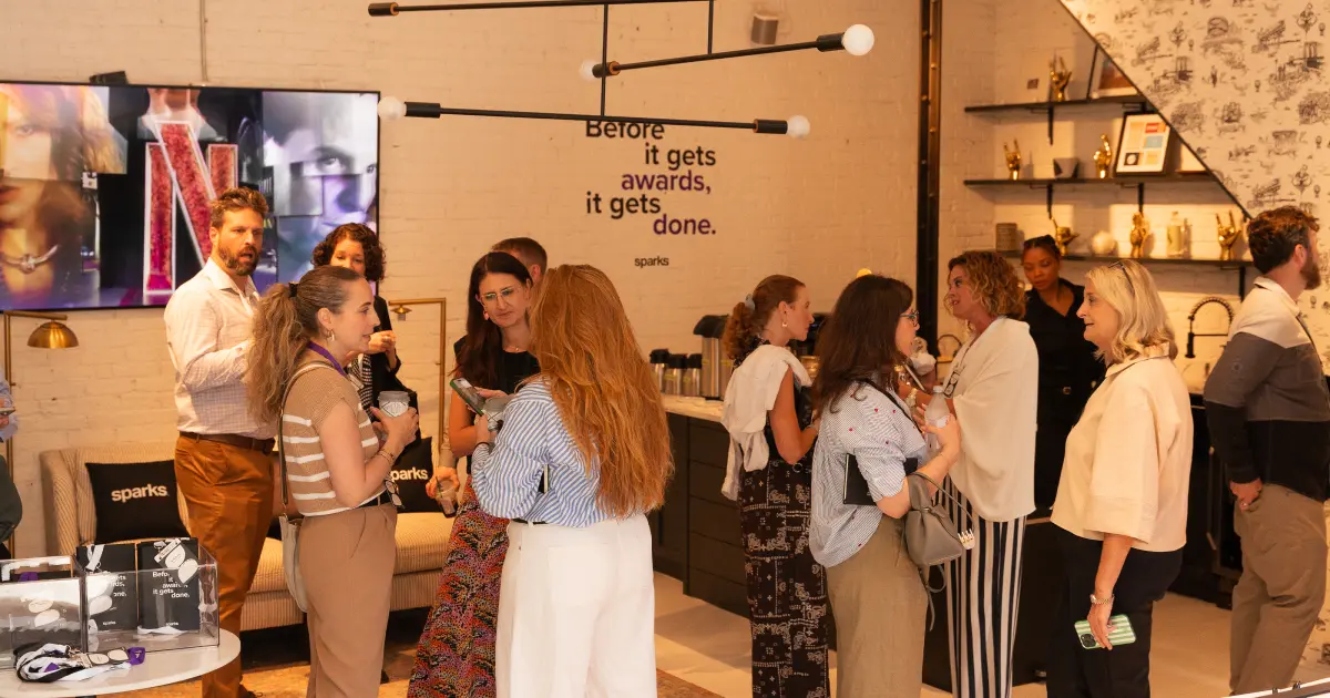 Sparks UnCanned 2026 reception with the "Before it gets awards, it gets done" wall
