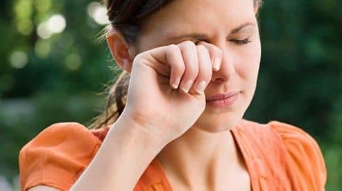 Getty rf photo of woman rubbing eye 493x276