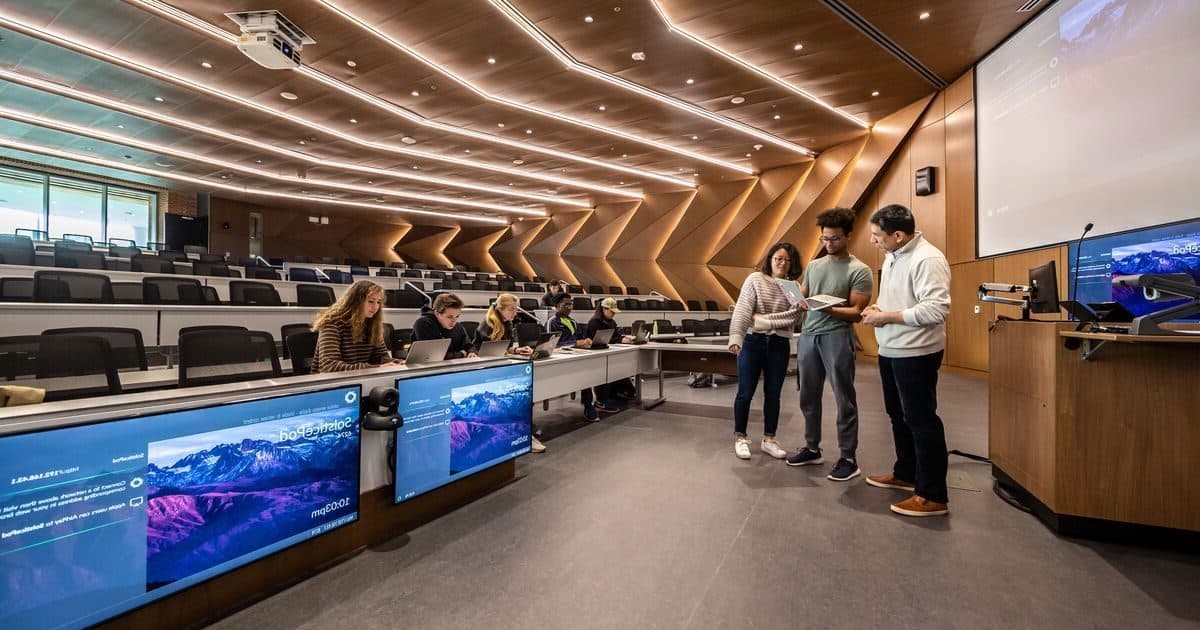Students working in the Michael Antonov Auditorium in the Brendan Iribe Center for Computer Science and Engineering.