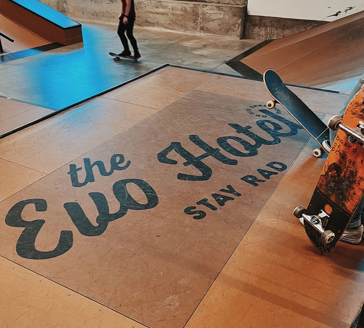 An EVO logo on a skatepark floor.