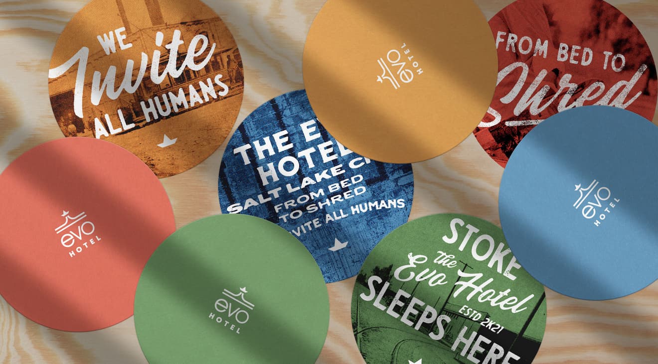 A top-down view of colorful EVO Hotel coasters.