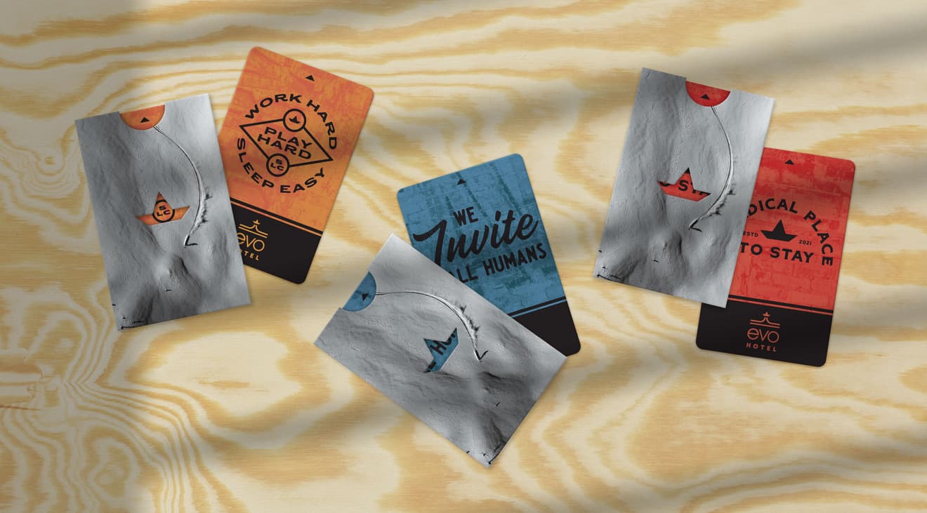 A top-down view of EVO Hotel key cards.