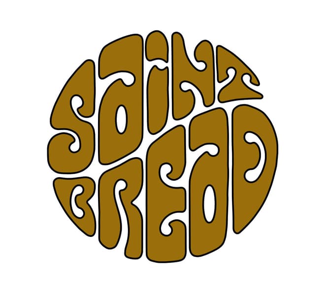 A psychedelic Saint Bread logo in the shape of a circle with a black stroke and a gold fill.