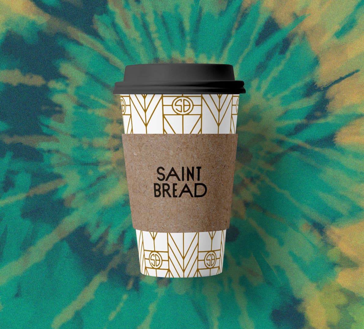A Saint Bread cup on a tie-dye background.