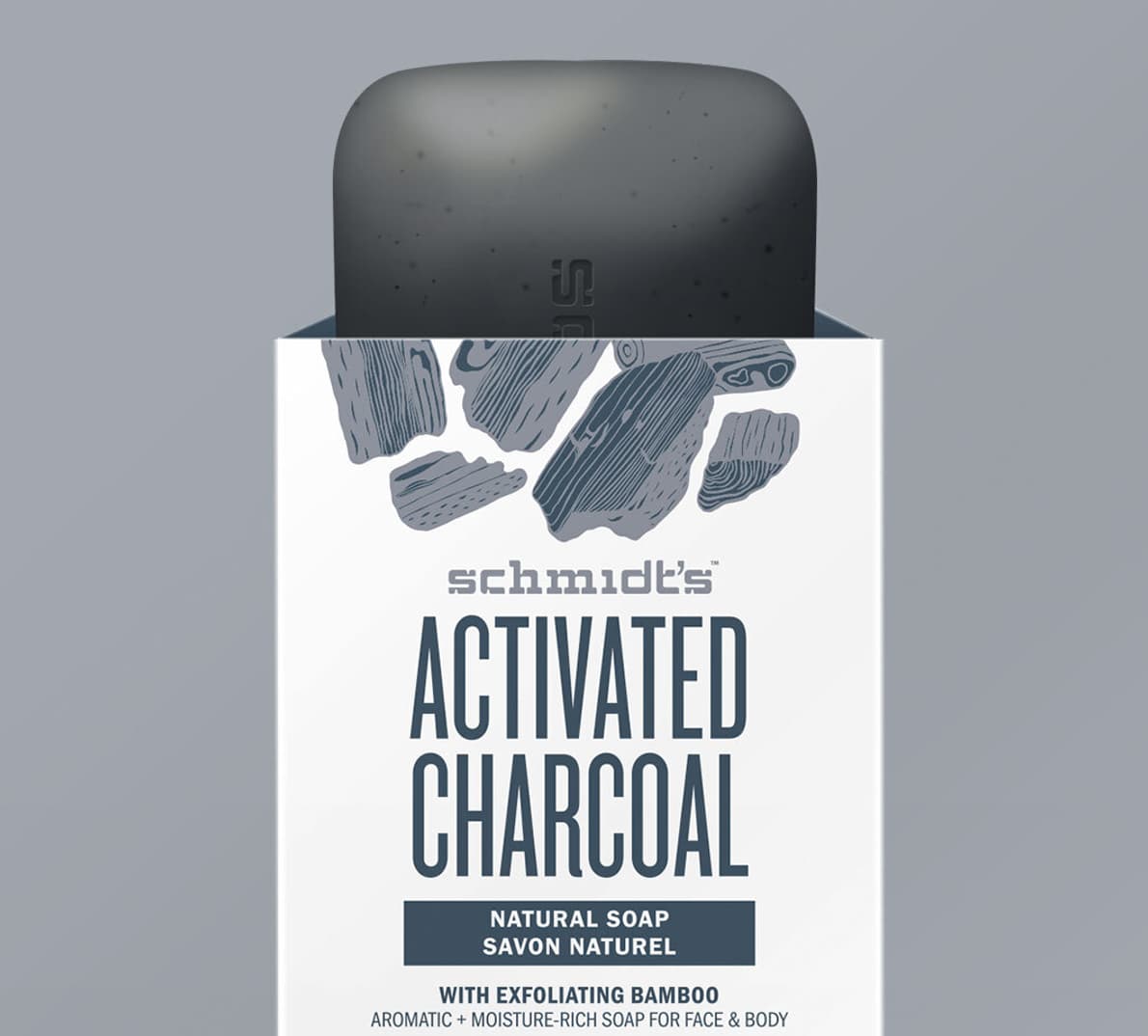 A mockup of the activated charcoal soap packaging with the bar of soap sticking out.