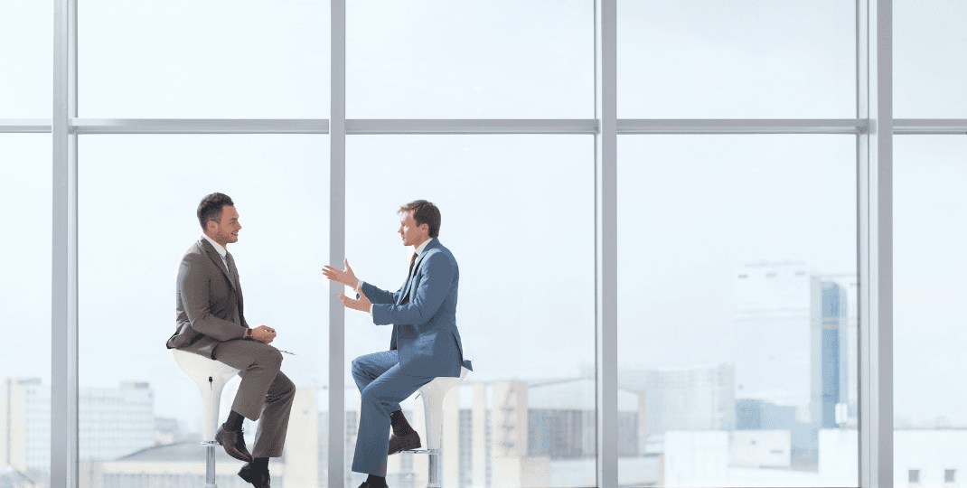 Two men discussing in an office