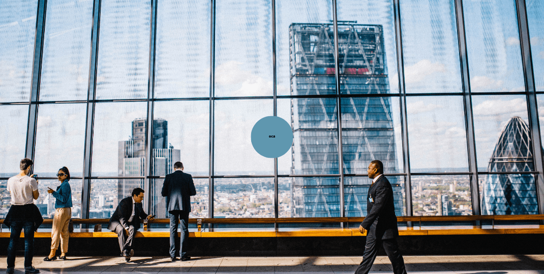 People walking and talking in a skyscraper