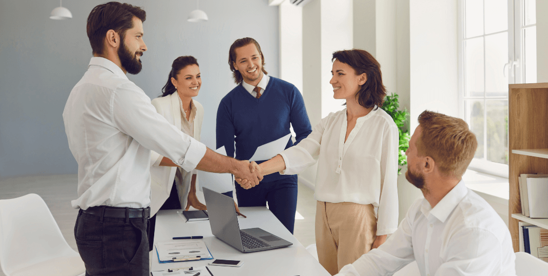 People shaking hands in an office