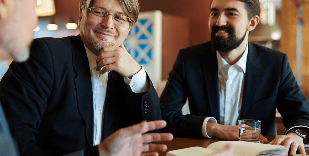 Men discussing at a table