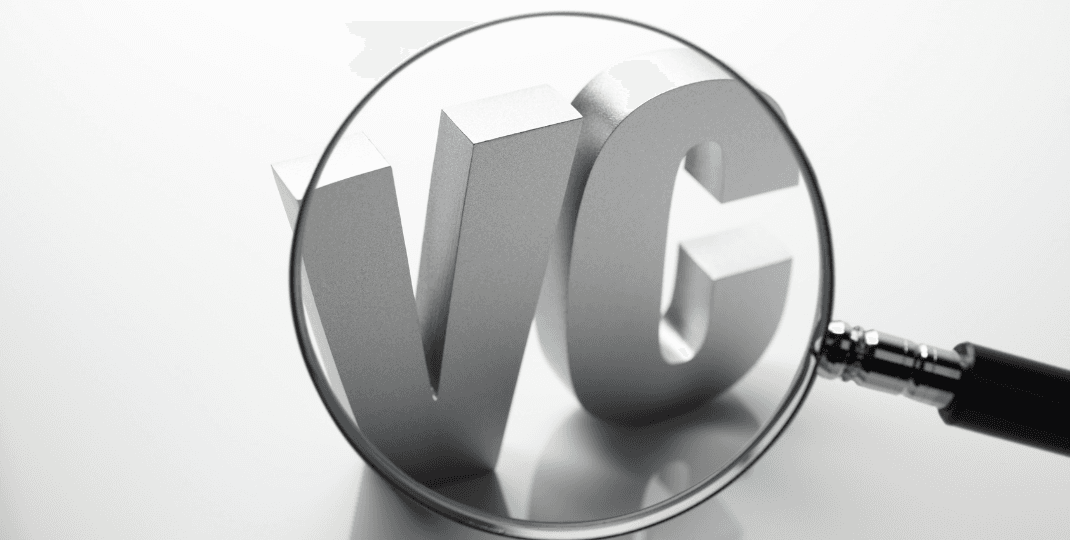 VC letters in a magnifying glass